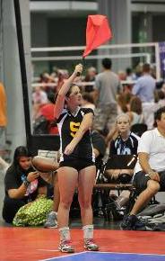 Volleyball line judge signaling server foot fault